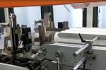 Automatic bath tissue paper roll bundle packing machine