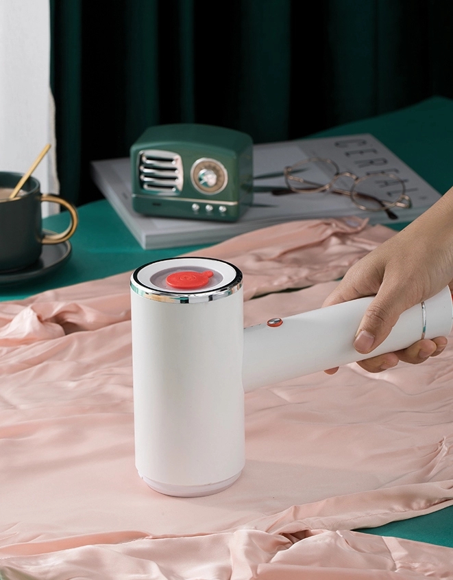 Compact Travel Garment Steamer with Hair Brush Accessory Product Size 23.25x17x7.4 cm