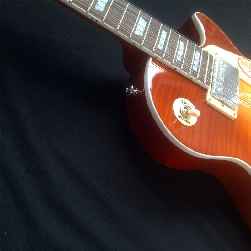 Standard LP electric guitar with gold hardware and flower inlay