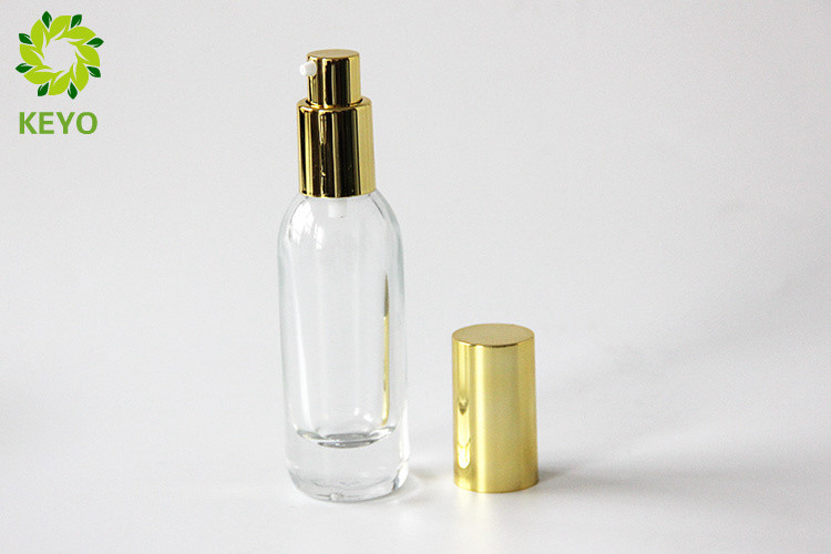 Clear Glass Foundation Bottle 30ml Thick Bottom Type With Gold Aluminium Pump