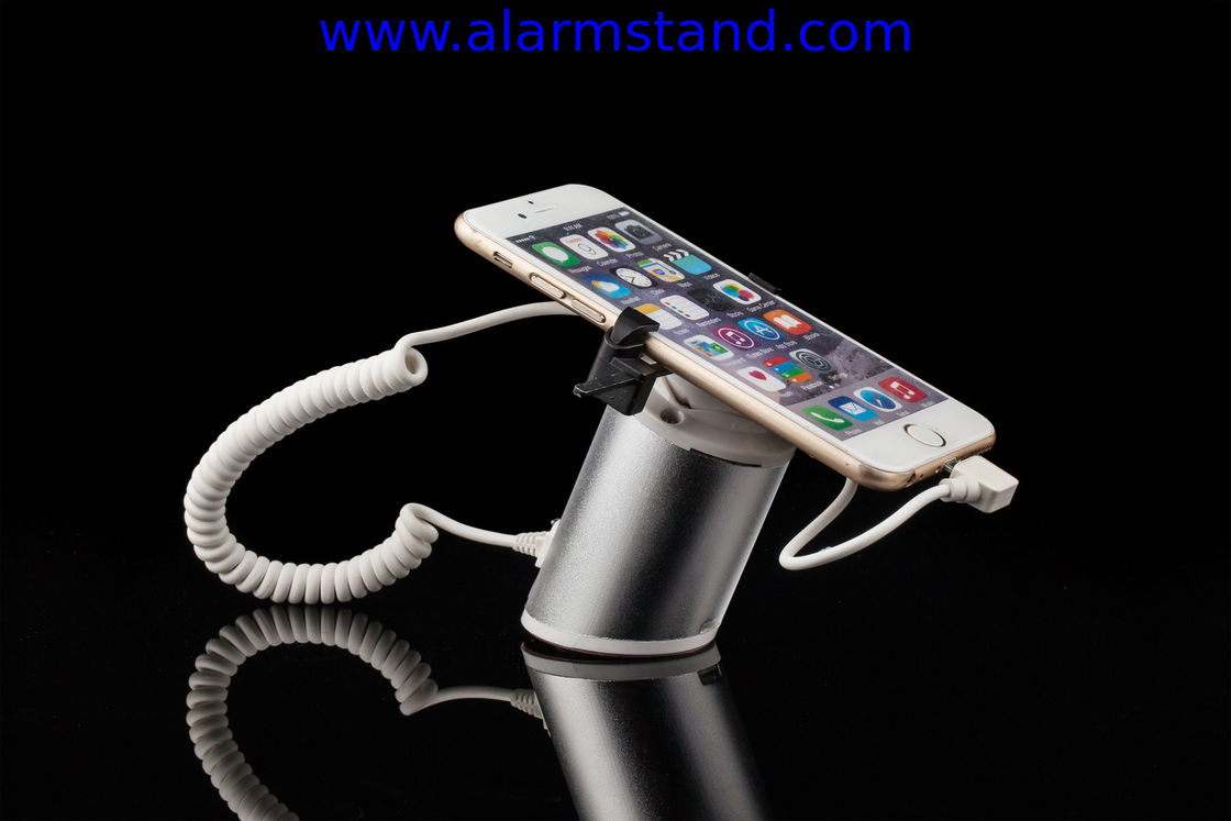 COMER High quality Rotating display stand for phone with charging cable and alarm sensor