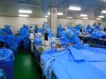 Surgical gown with knitted cuff,velcro on the back neck,four waist belts,with