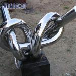 Large geometric circular tube rope stainless steel sculpture