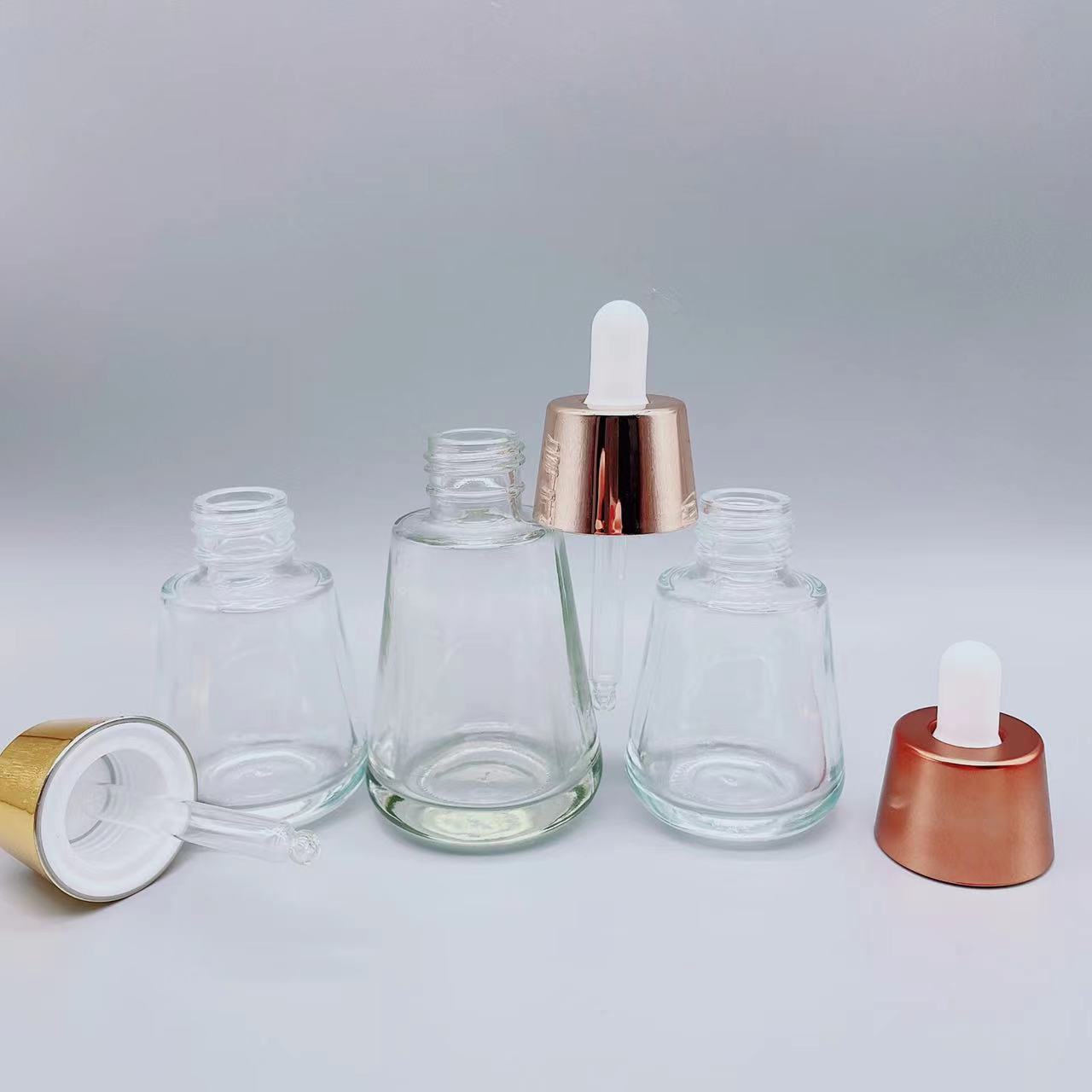 Industrial Cosmetic Elegant 30ml 50ml 1oz 2oz Green Empty Oil Serum Dropper Bottles with Box Customize Unique Cone Shape