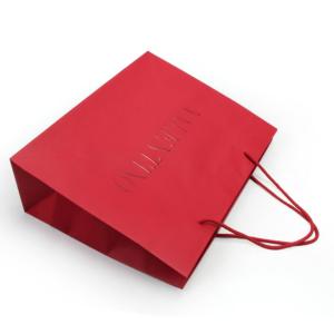 Quality 4C 6C Offset Printing Garment Paper Bags Dazzling Red Paper Gift Bags With Handles wholesale