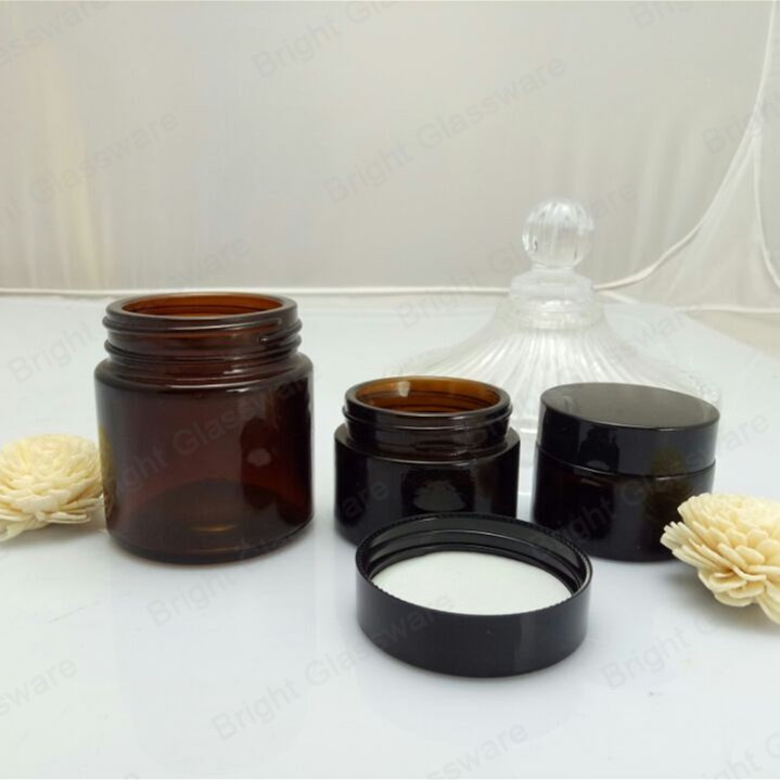 Face cream amber glass jar with black plastic cap