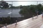Round Steel Frameless Glass Balcony Railing Outdoor With Solid Wood Handrail