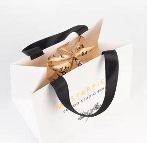 Quality Art Paper Shopping Bag Packaging Kraft Paper Bag With Embossed Logo wholesale