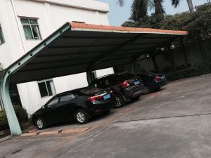 Quality 4 sets Small Cars Parking Shed Garage Steel Frame With Red Arc Shape Roof Top wholesale