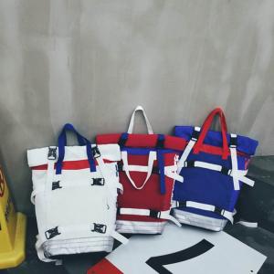 Quality Contrast color roll mouth portable travel backpack European and American large-capacity couple backpack wholesale