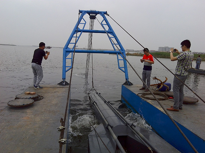 The cutter suction dredger with a blue color is designed to dig to a depth of nine meters
