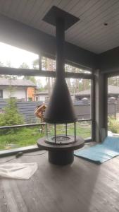 Quality Carbon High Grade Black High Style Luxury Modern Steel Round Furniture Glass Art Rotating Furniture rooftop fireplace wholesale