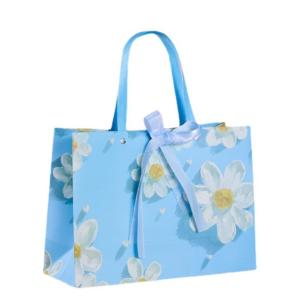 Quality Fresh White Chrysanthemum Pattern Sky Blue Cardboard Gift Bags With Ribbon Fashion Tote Bag wholesale