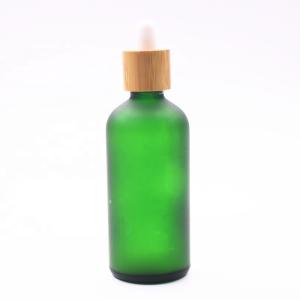 Quality 18/410 100ml Frosted Green Glass Liquor Empty Essential Oil Bottles Bamboo Dropper wholesale